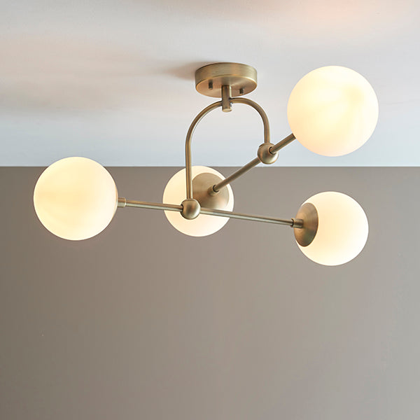 Matt antique brass semi-flush with opal glass