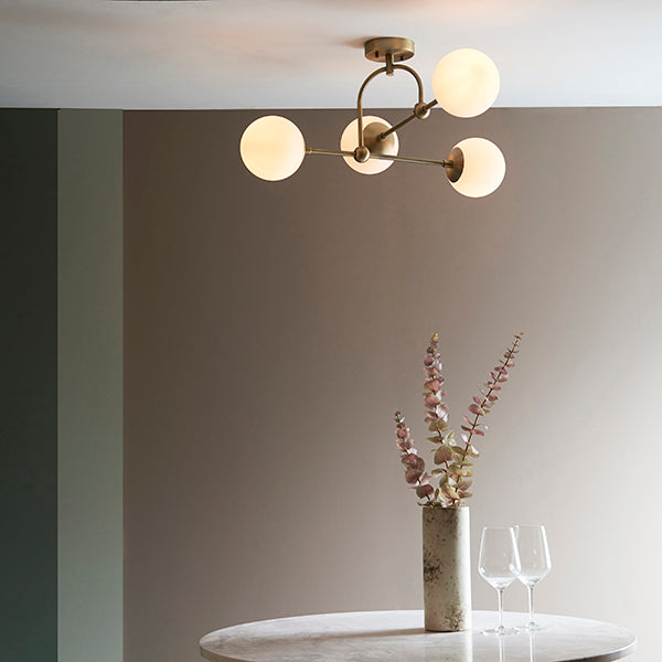 Matt antique brass semi-flush with opal glass