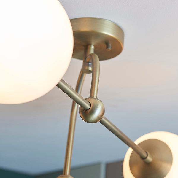 Matt antique brass semi-flush with opal glass