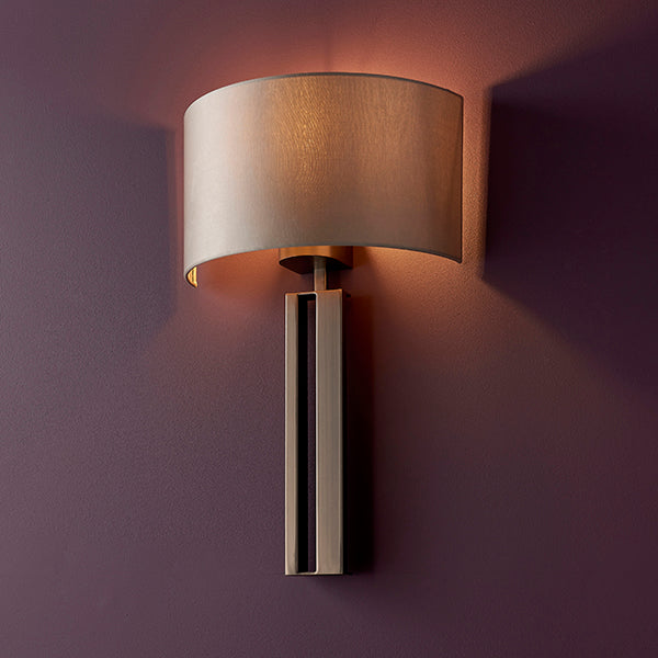 Bronze slotted wall light with mink shade