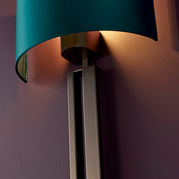 Bronze slotted wall light with teal shade