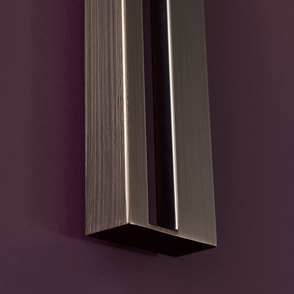 Bronze slotted wall light with teal shade