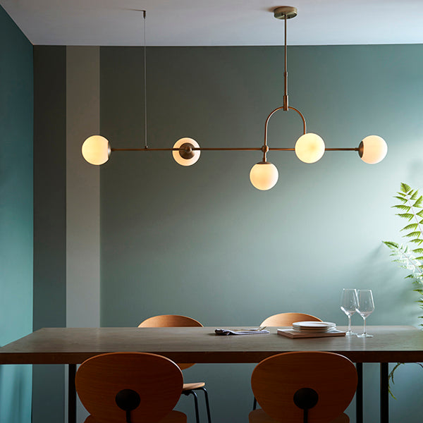 Matt antique brass linear pendant with opal glass and adjustable stem
