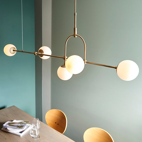 Matt antique brass linear pendant with opal glass and adjustable stem