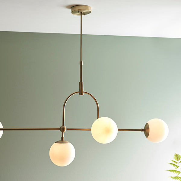 Matt antique brass linear pendant with opal glass and adjustable stem