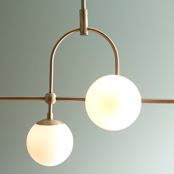 Matt antique brass linear pendant with opal glass and adjustable stem