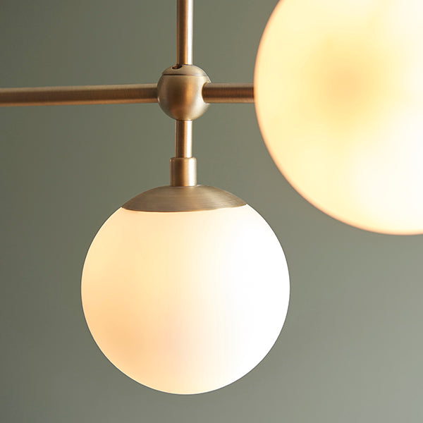 Matt antique brass linear pendant with opal glass and adjustable stem