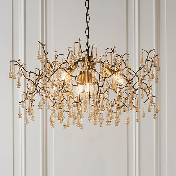 Aged gold branch chandelier with glass droplets