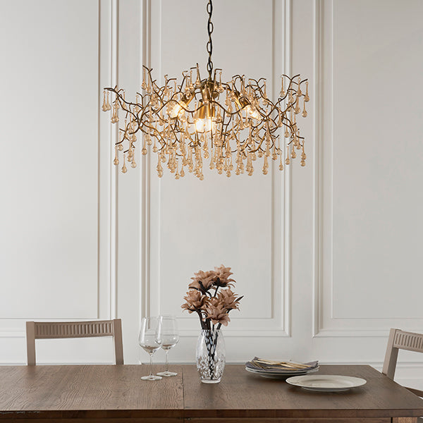Aged gold branch chandelier with glass droplets