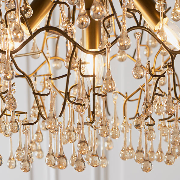 Aged gold branch chandelier with glass droplets