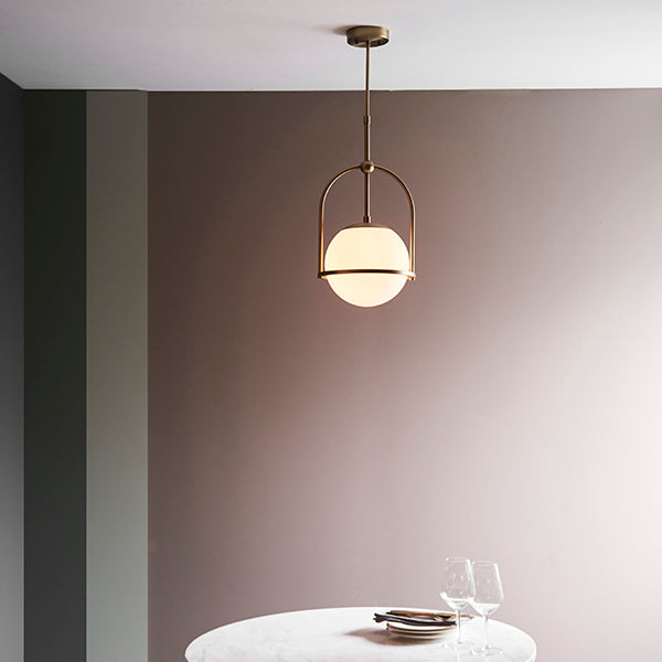 Matt antique brass single pendant with opal glass and adjustable stem