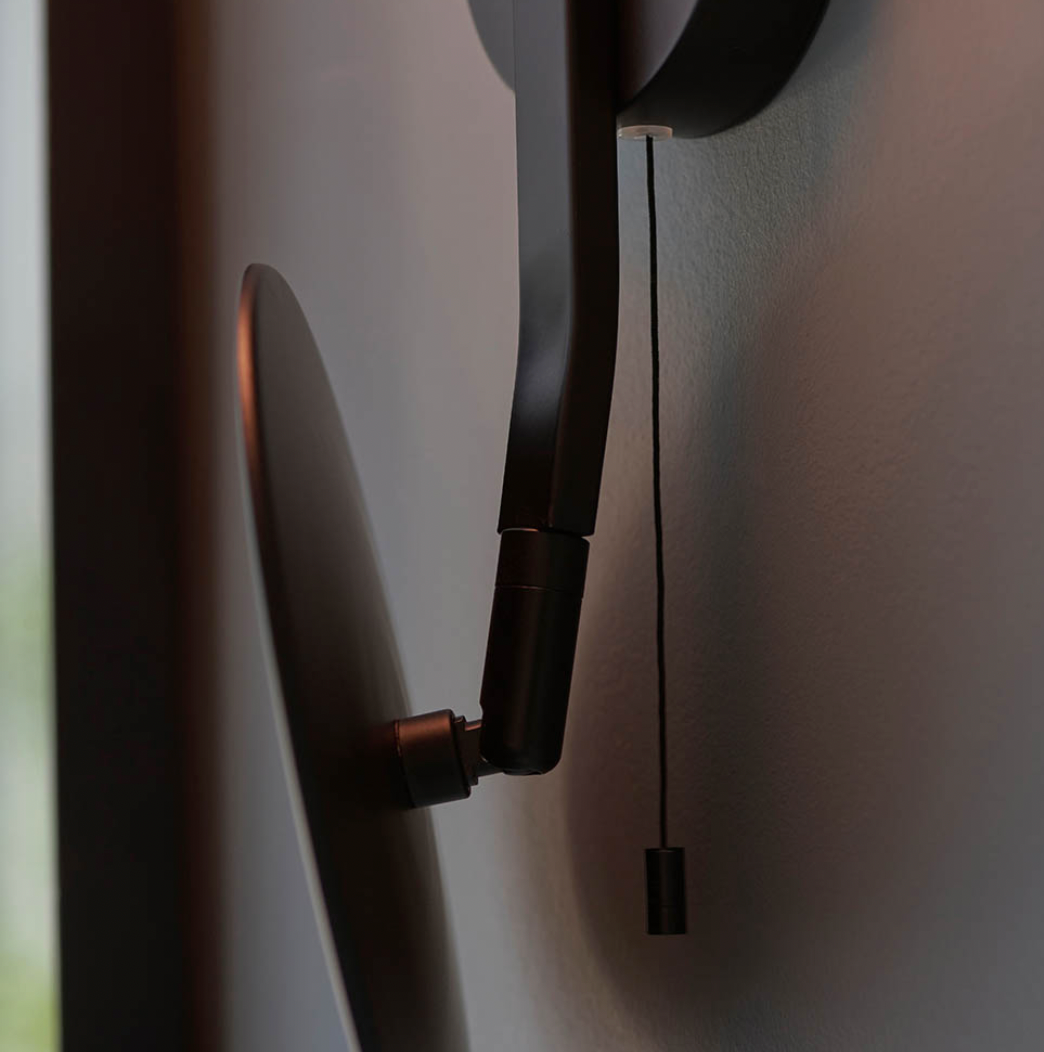 Mirrored IP44 black wall light with opal glass shade
