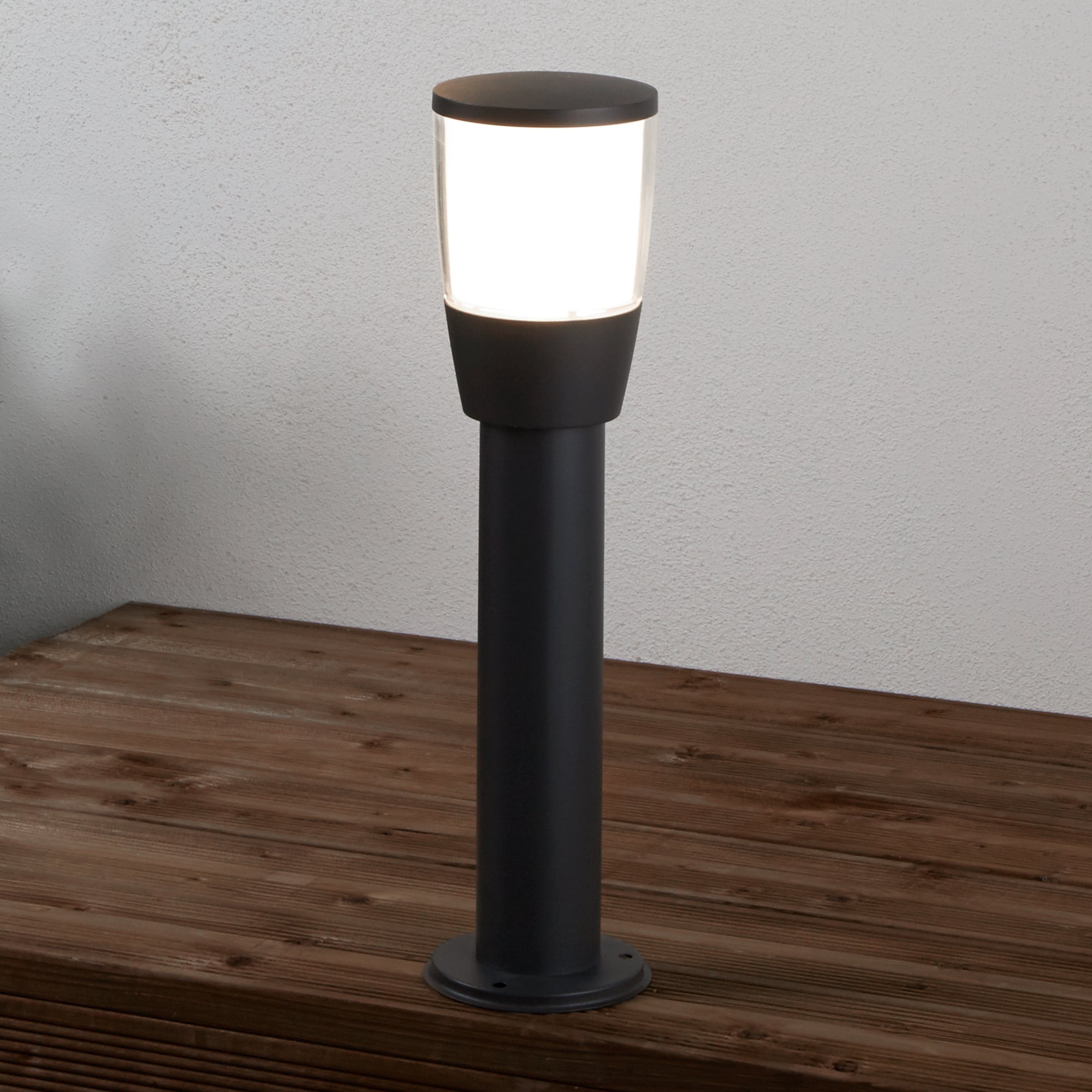 Black bollard light, also known as a post light. Black post with a polycarbonate clear diffuser and frosted inner.