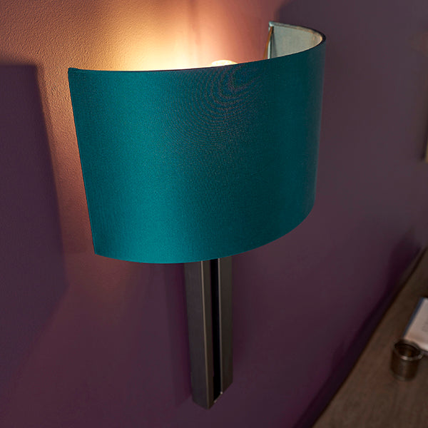 Bronze slotted wall light with teal shade