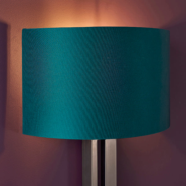 Bronze slotted wall light with teal shade