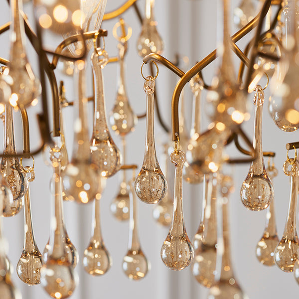 Aged gold branch chandelier with glass droplets