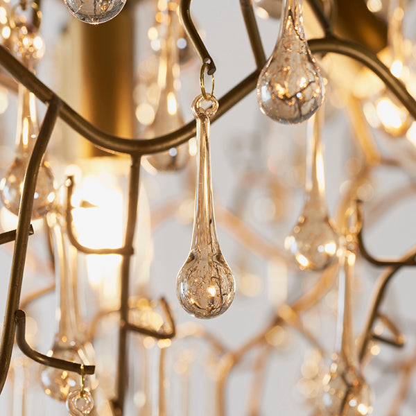 Aged gold branch chandelier with glass droplets